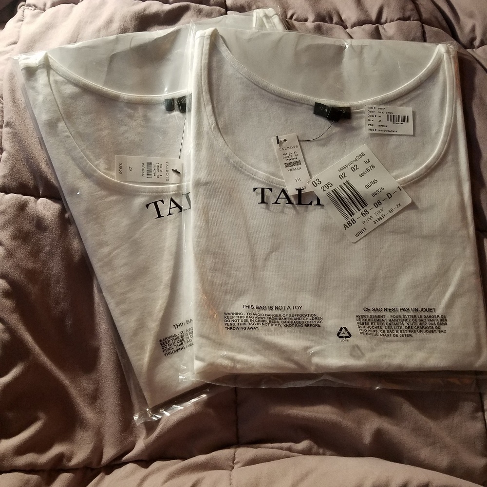 Two plain white tank tops